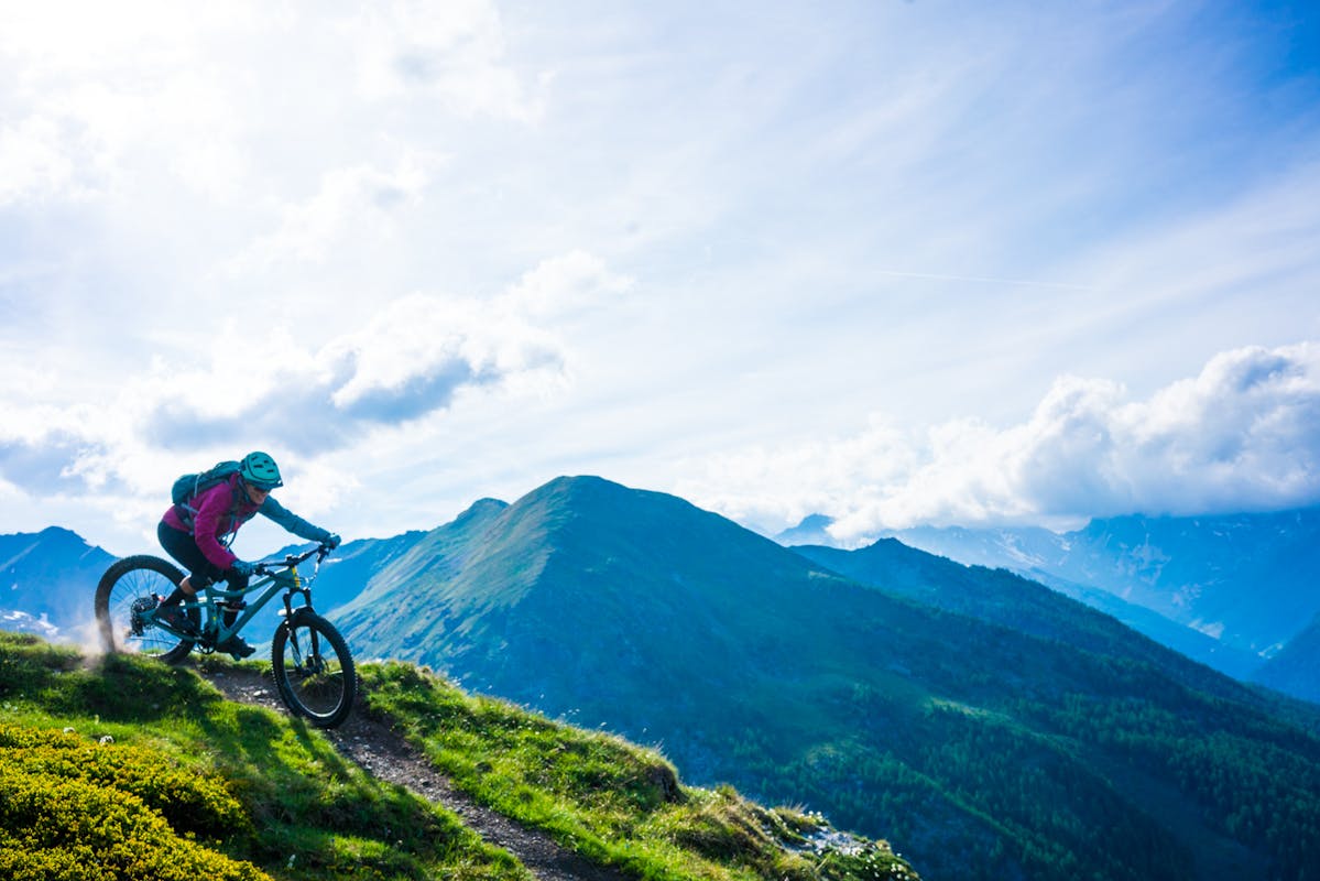 Britt Greer riding single track in Aosta, IT