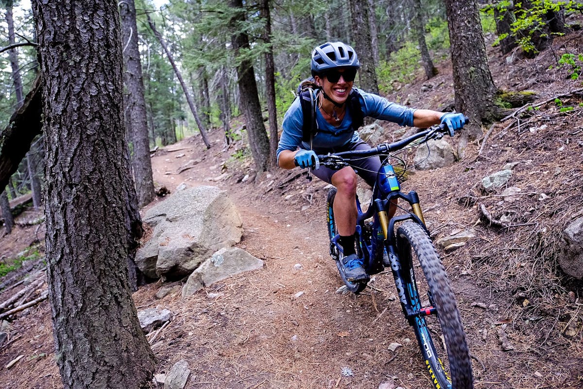 Nichole Baker finding loam covered single track. 