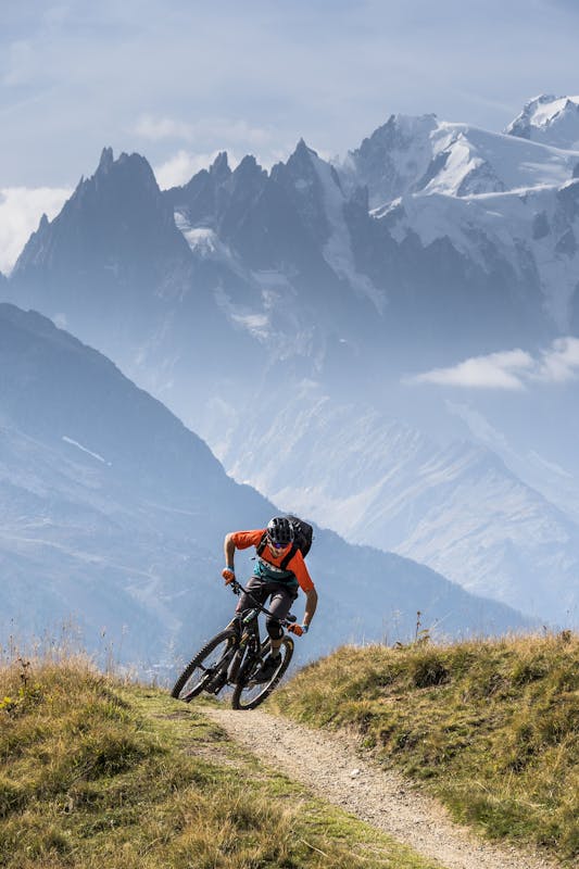 Francesco Gozio riding single track near Mt. Blanc